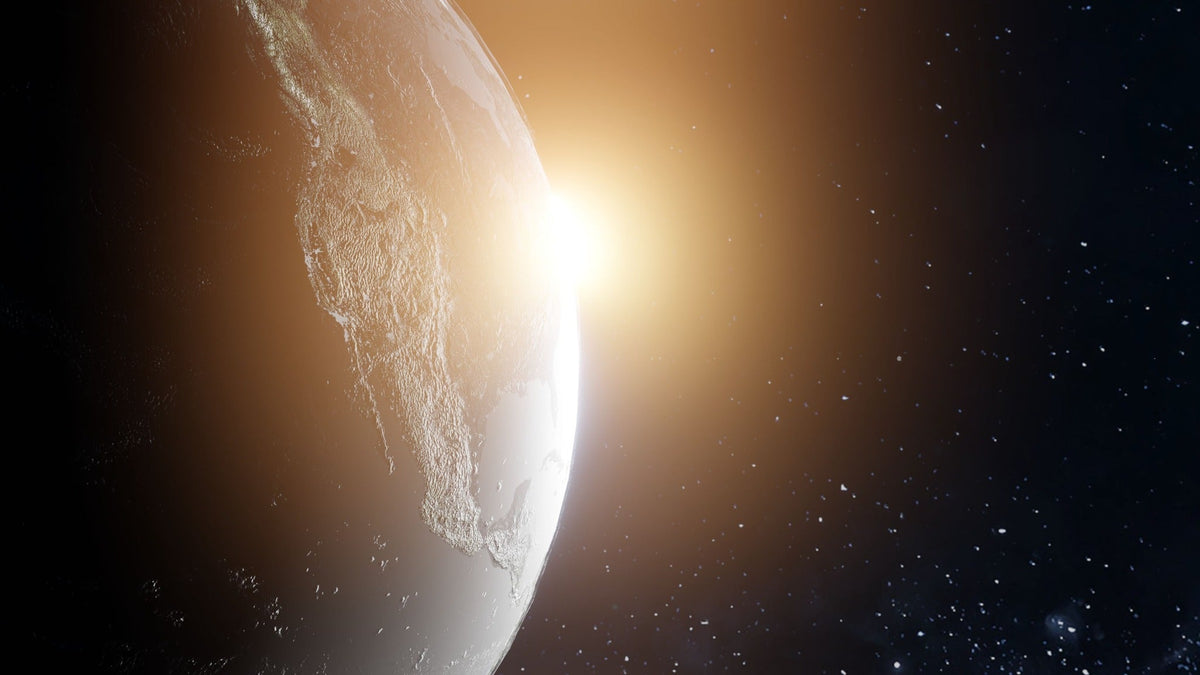 Planet Earth rising into golden light against a field of stars, representing creation, holy-time, discovery and the world of Holosbiblion.